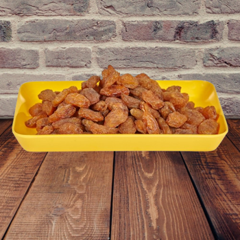 Golden Munakka Raisins in a container.